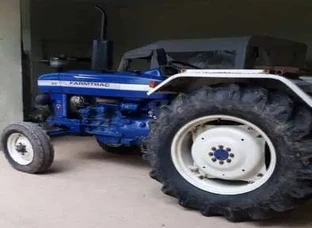 Blue And Black Tractor With Trailer