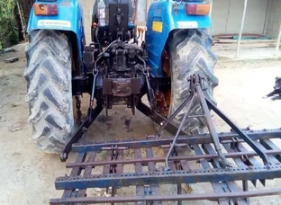 Tractor (New Holand) with cultivator 