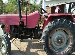 Red And Black Tractor With Plow Blade